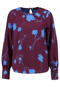 Blouse bordeaux à manches longues, avec un motif floral bleu. Encolure ronde avec une ouverture en forme de goutte d'eau à l'arrière. Texture de tissu lisse.