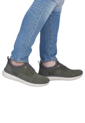 Green athletic shoes with textured fabric upper, gray accents, and white rubber sole. Laced design with a pull tab at the heel.