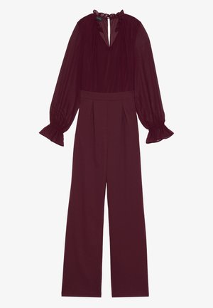 Burgundijas kombinezons ar plisušiem plašiem biksēm, teksturētām caurspīdīgām garām piedurknēm, viļņotu dekoltē un atslēgas cauruma aizmugures detaļu.