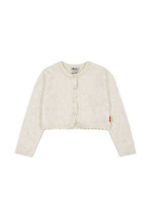 Cremefarbener, kurz geschnittene Cardigan mit langen Ärmeln, gewellten Kanten, Knopfleiste vorne und einem kleinen gelben Etikett an der Seitennaht.