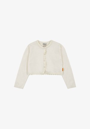 Cardigan court de couleur crème avec manches longues, bords festonnés, fermeture boutonnée à l'avant et une petite étiquette jaune sur la couture latérale.