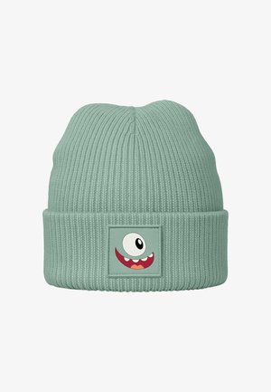 Mint green knit beanie with ribbed texture. Features a patch with a cartoon monster face, single eye, red mouth, and white teeth.