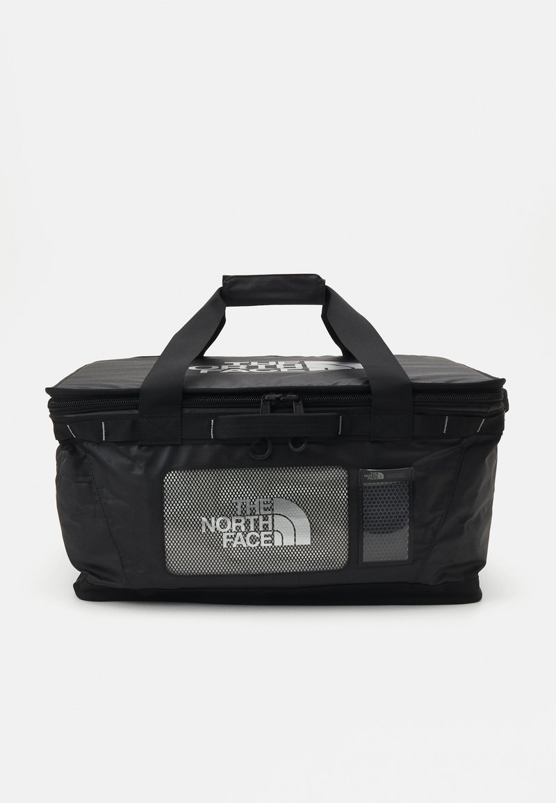 Black insulated bag with a zippered top, two sturdy handles, and a mesh panel featuring "The North Face" logo on the front.