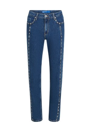 Denimjeans i mørkeblå med rett snitt, og som har kontraststing og dekorative nagler langs sidesømmene og foran lommene.