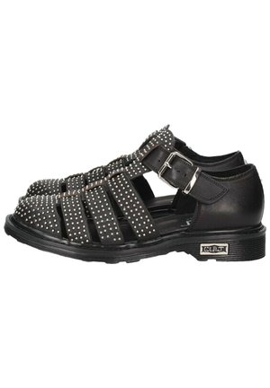 Sandali neri con cinturini borchiati, design open toe, fibbia regolabile e dettaglio della suola testurizzata. Adatti per un abbigliamento casual.
