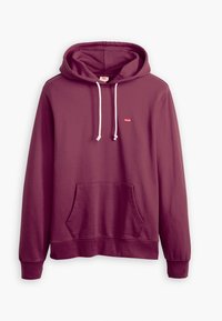 Bordový mikina s kapucí a klokankou, bílými tkaničkami a malým červeným logem na hrudi. Měkká tkanina s pružnými manžetami.