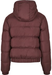 Burgunderrød boblejakke med hette, med en quiltet design, elastiske manchetter og en innsnøring i hemmen for en tettsittende look. Myk tekstur og lett vekt.