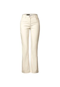 Beżowe dzwony wykonane z mieszanki bawełny, z zapięciem na guziki i zamek, przednimi kieszeniami oraz gładką fakturą.