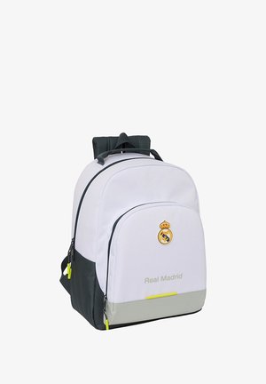 Biała i czarna plecak z logo Real Madrid i napisem, wieloma zapinanymi kieszeniami, wyściełanymi paskami oraz neonowymi suwakami.