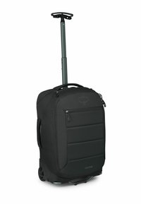 Borsa da viaggio nera con ruote, manico retraibile, anteriore imbottito, tasche con cerniera e tessuto resistente. Caratterizzata da ruote lisce che rotolano facilmente.