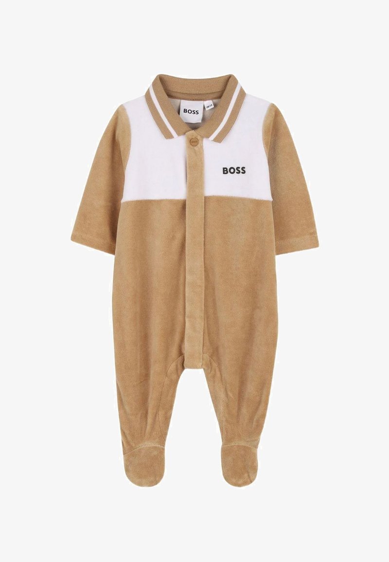 Combinaison en polaire marron et blanc avec manches courtes, col, boutons-pression et logo. Pieds couverts, texture douce, design décontracté.