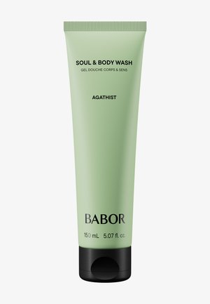 Green plastic tube with black base, labeled "Soul & Body Wash," 150 mL. Features minimalist design and smooth texture.
