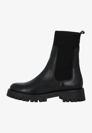 Botas Chelsea negras con un cuerpo de cuero suave y costuras elásticas acanaladas. Presenta una suela de goma gruesa con un dibujo texturizado para mayor agarre.