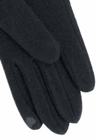 Gants en laine noirs avec une texture douce, comportant quatre doigts, un pouce et une paume décorée d'un petit cœur.