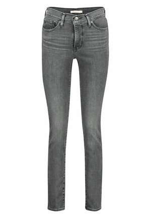 Jean slim gris en denim avec cinq poches, fermeture à bouton et zip, et légère décoloration sur l'avant des cuisses.