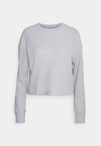 Grijze cropped sweatshirt met een gestructureerd ribbelpatroon, ronde halslijn en lange mouwen met aansluitende manchetten. Naadloos ontwerp.