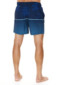 Trunks de bain bleu marine avec un motif de palmier, présentant des rayures horizontales et une taille élastique. Comprend une poche arrière.