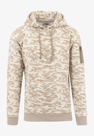 Beige-weißer Tarnfleck-Hoodie mit Vordertasche, Kordelzugkapuze, gerippten Bündchen und Saum sowie Reißverschlusstasche am linken Ärmel.
