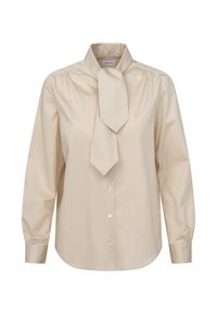 Beige long-sleeve blouse with a high collar and bow tie detail, featuring button closures and gathered sleeves for a structured fit.