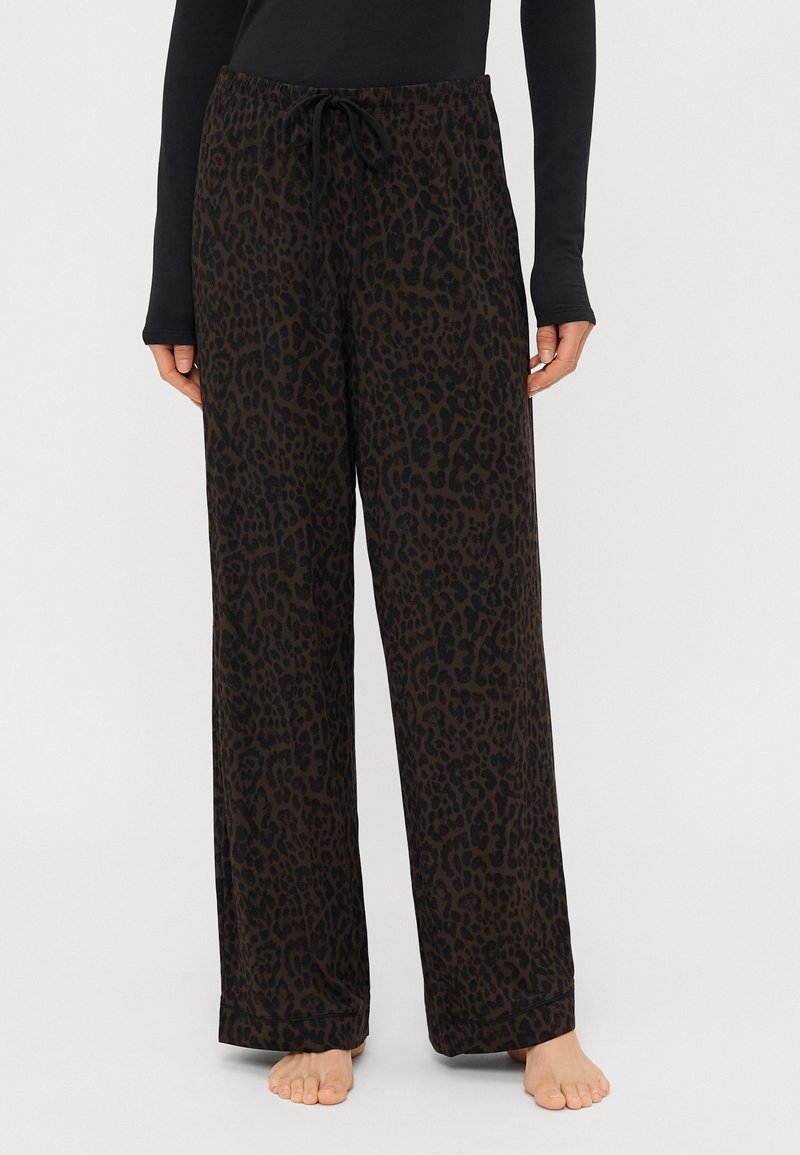 Pantaloni neri con motivo a leopardo; realizzati in materiale morbido; presentano una vita elastica con lacci e un design a vestibilità rilassata.