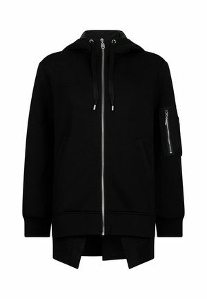 Sweat à capuche noir zippé avec une poche avant, des cordons de serrage et une poche latérale avec fermeture éclair. Matière douce et coupe décontractée avec une fente au bas.