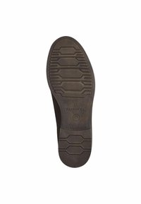 Semelle en caoutchouc noire avec un motif de relief hexagonal, surface texturée et accents en relief. Présente le nom de la marque "Toms" et la taille 37.