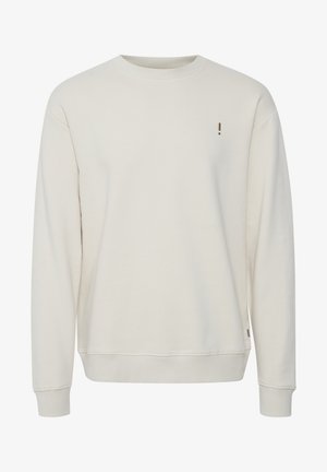 Lys beige sweatshirt med avslappet passform, lange ermer, ribbestrikket halsutringning og mansjetter, har en liten logo på brystet, laget av mykt stoff.
