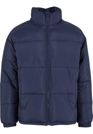 Navy blue puffer jacket with a high collar, front zipper, and horizontal quilted sections. Made from smooth, lightweight fabric.