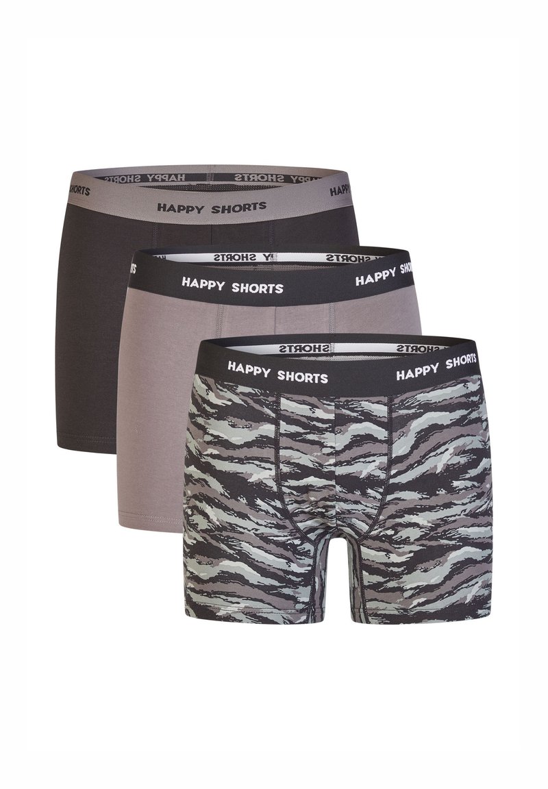 Three pairs of men’s boxers: one solid black, one solid gray, and one with a gray and black tiger stripe pattern. All have elastic waistbands.