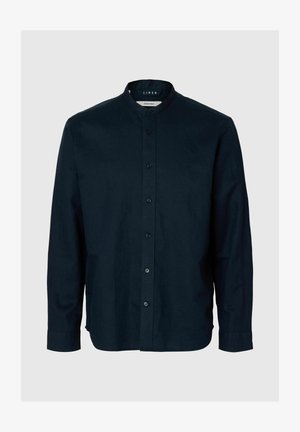 Tengerészkék hosszú ujjú len ing mandzsettagallérral és elöl gombolható zárral, semleges háttéren bemutatva.