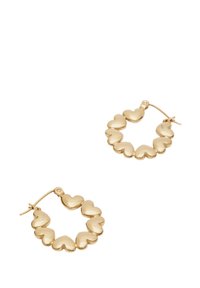 Orecchini a cerchio in oro a forma di piccoli cuori, con superficie lucida e chiusura sicura. Ogni orecchino presenta otto dettagli a forma di cuore.