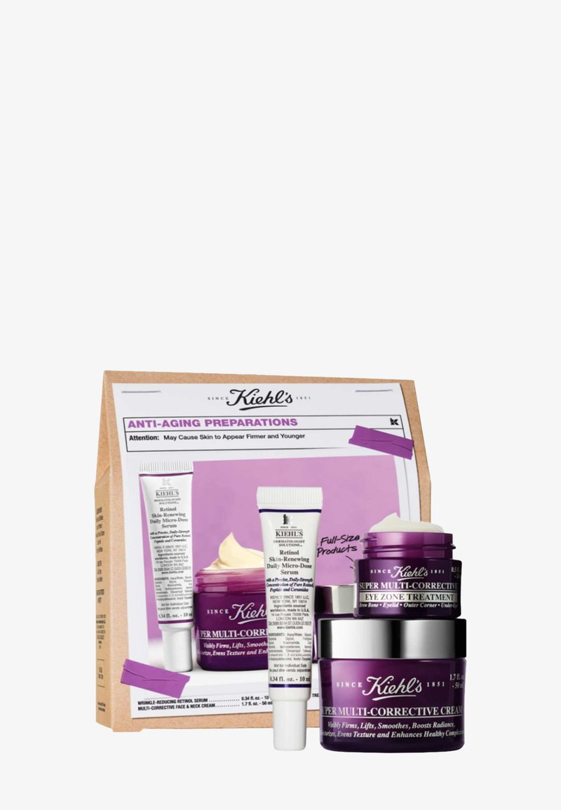 Kiehl's anti-aging sæt inkluderer tre lilla krukker og rør i forskellige størrelser, indeholdende en papkasse med produktinformation og et design i lavendel.