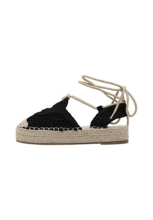 Sandale espadrille noire tissée avec semelle plateforme en jute beige et liens beiges à enrouler autour de la cheville sur fond blanc.