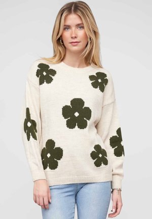 Maglione lavorato a maglia color crema con motivi floreali verde scuro. Presenta un collo rotondo e polsini a costine, progettato con una vestibilità rilassata.