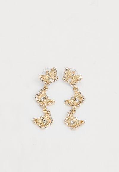 Ohrringe in Goldfarbe, die aus fünf Schmetterlingsformen bestehen, verziert mit klaren Strasssteinen und mit filigranen Details sowie einem kaskadierenden Design.