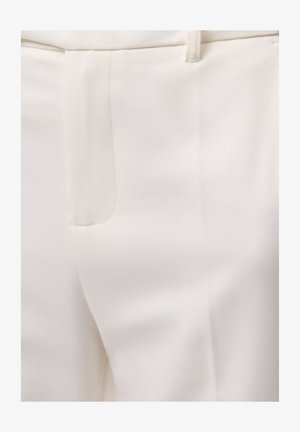 White tailored trousers featuring smooth, matte fabric with a subtle sheen, clean lines, and a side pocket for functionality.