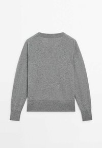 Grey sweater with long sleeves, made from a soft, textured knit material. Features a round neckline and a ribbed hem at the waist and cuffs.