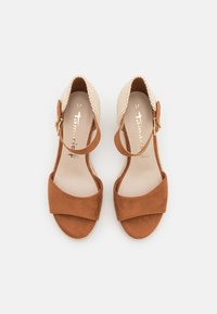 Paire de sandales ouvertes en daim marron taille 37 avec talons tressés et brides de cheville avec boucles dorées, posées à plat sur fond blanc.