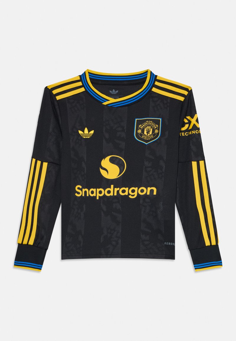Mustard must sleeves jersey, mille ja siniste aktsentidega, õlgadel triibud, Manchester Unitedi logo ja Snapdragon bränding.