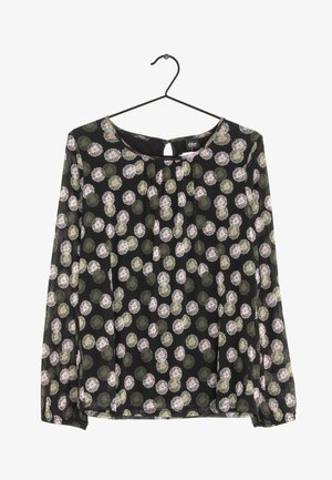 Blouse noire à manches longues avec encolure ronde et motif floral abstrait intégral en vert, blanc et rose, suspendue à un cintre noir.