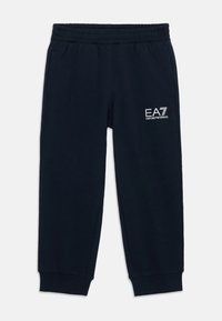 Pantalones de chándal azul marino hechos de algodón suave, con una cintura elástica, puños ajustados y un detalle del logo blanco de EA7 en el costado.