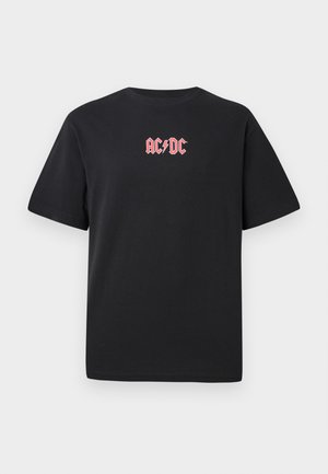 Czarna bawełniana koszulka z krótkim rękawem, z różowym logo AC/DC na froncie oraz okrągłym dekoltem. Klasyczny krój i gładka tekstura.