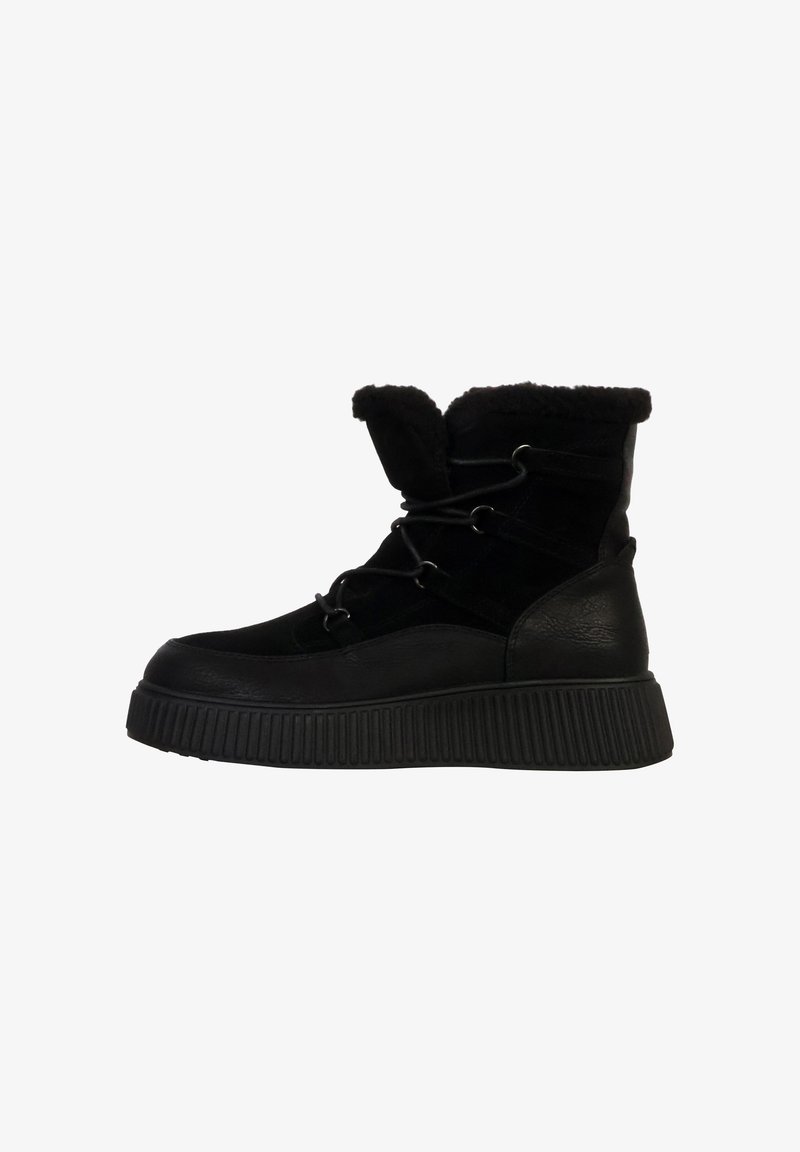 Black ankle boots featuring a textured upper, fur lining, and a round toe. Thick rubber sole with horizontal grooves for traction.