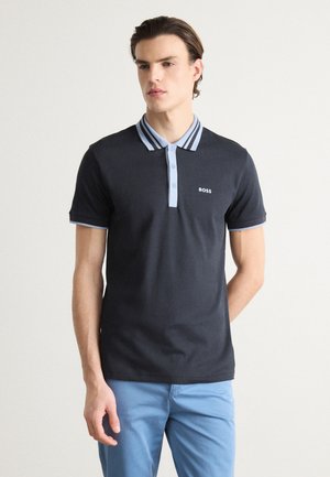 Dark navy polo shirt with a light blue striped collar and cuffs. Features a three-button front, embroidered logo on the chest.