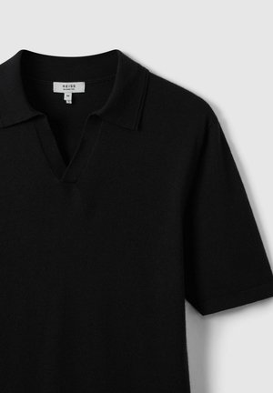 Black short-sleeve polo shirt made of soft fabric, featuring a v-neck and a classic collar, with minimal stitching and no visible patterns.