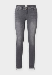Jean skinny gris foncé avec poches avant, fermeture à boutons, passants de ceinture et fermetures éclair aux chevilles, présenté sur un fond clair.