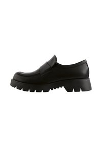 Chaussure noire en cuir à enfiler avec un bout arrondi, une tige rembourrée et une semelle en caoutchouc épaisse avec un motif de crampons.