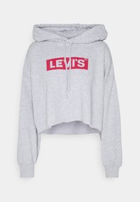 Felpa grigia cropped con cappuccio regolabile, presenta un logo rosso Levi's su sfondo bianco, tessuto morbido e polsini aderenti.