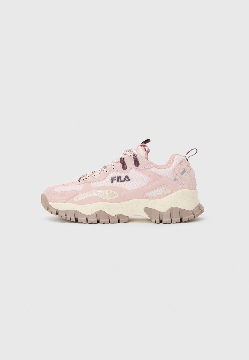 Light pink athletic shoe with mesh upper, textured overlays, chunky cream sole, and contrasting dark pink laces. Fila logo on side.