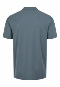 Hele sinine polo särk, lühikesed varrukad, ribaga krae, tekstuuriga kangas peene mustriga, sirge äär ja külje lõhikuga all.